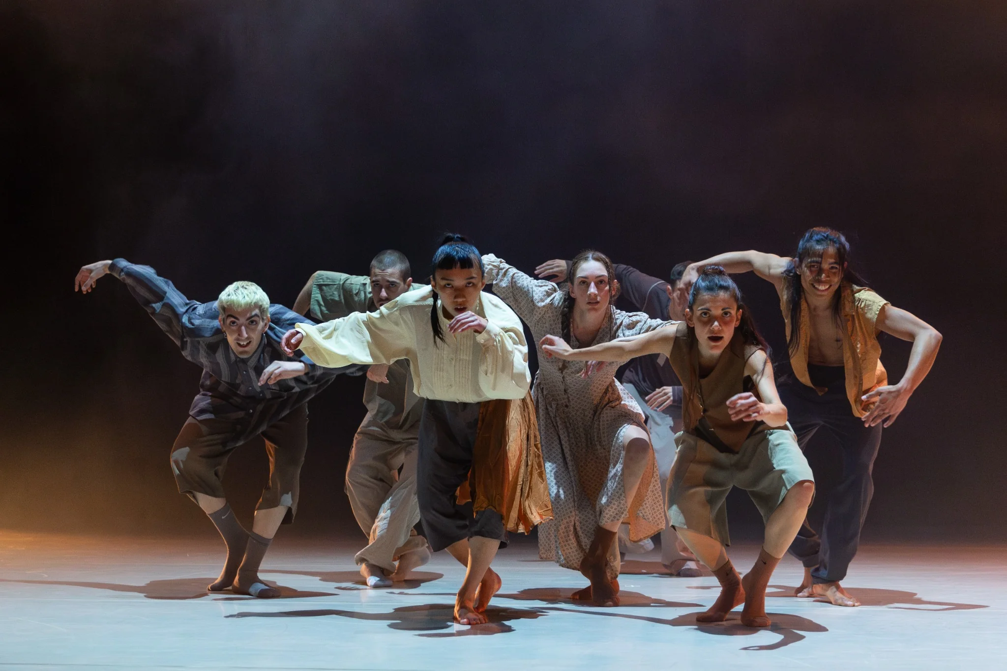 Of Curious Nature dancers reaching forward in A Thousand Steps to Silence