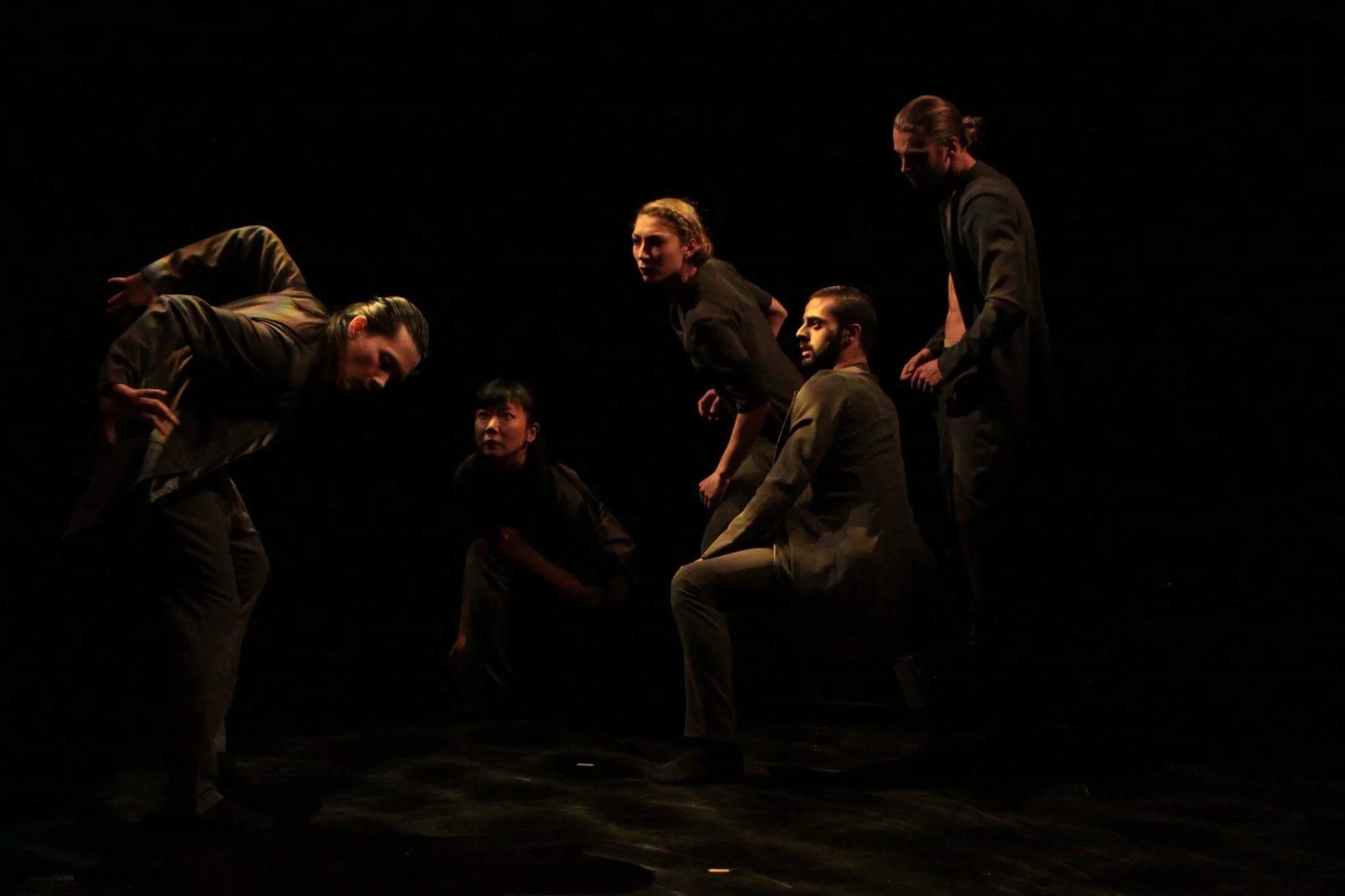 Five dancers folding and turning together in Origami for BallettPforzheim